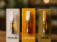 A comparison display of cannabis cartridges showing Distillate, Live Resin, and Rosin, each in